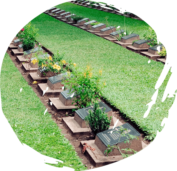Gardener tending graves in Cemetery